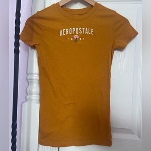 The color is orange. Bought it at Aeropostale